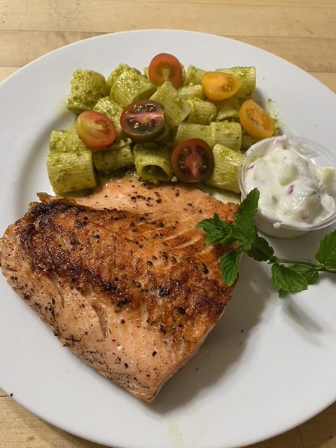 Seared Iron Skillet Wild Caught Salmon with Cheese -Less Pesto Pasta at Plain Yogurt Cucumber Red Onion and Fresh Mint Salad home cooked catering
